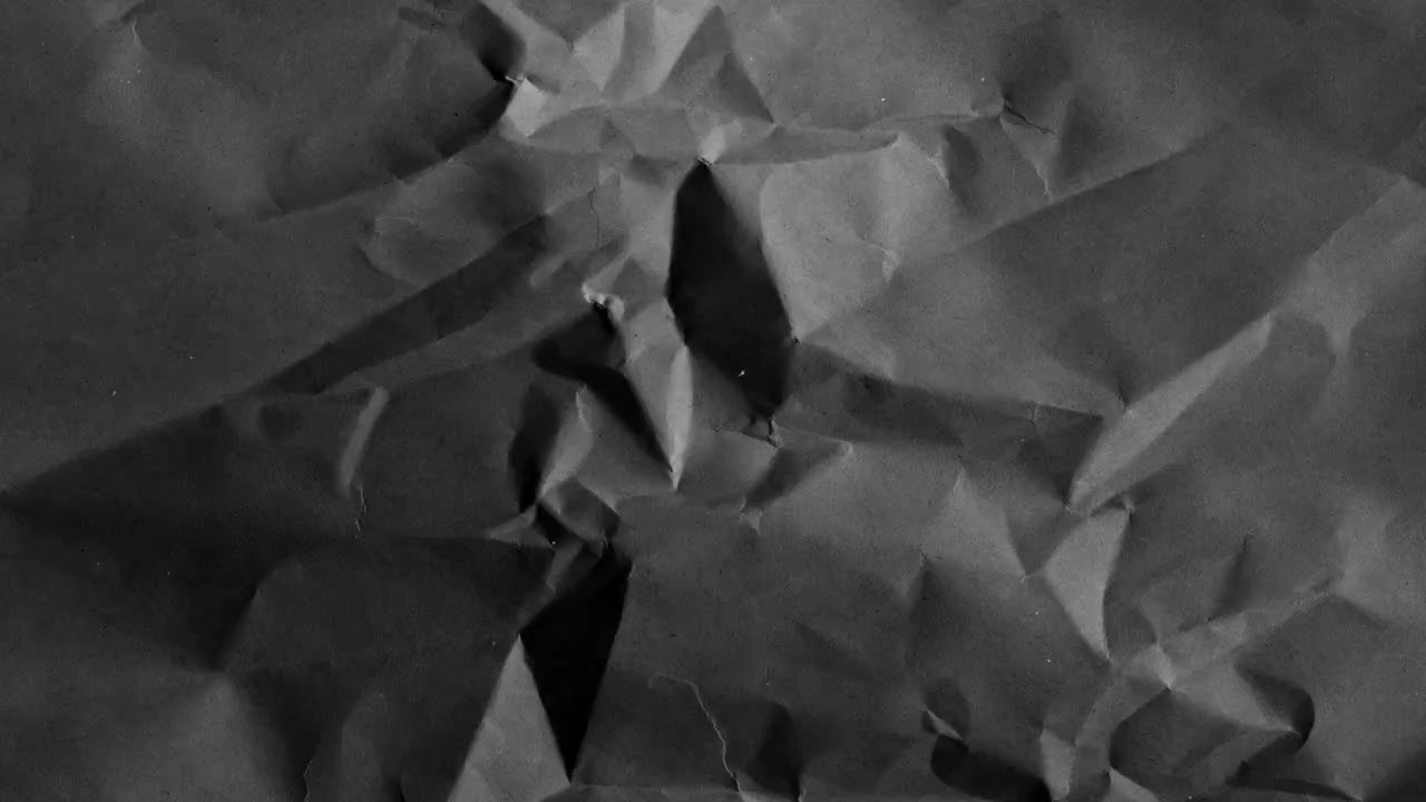 Dynamic Black and White Crumpled Paper Background Loop
