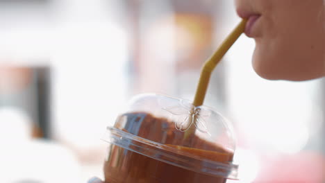 Woman-drinking-chocolate-cocktail-with-straw