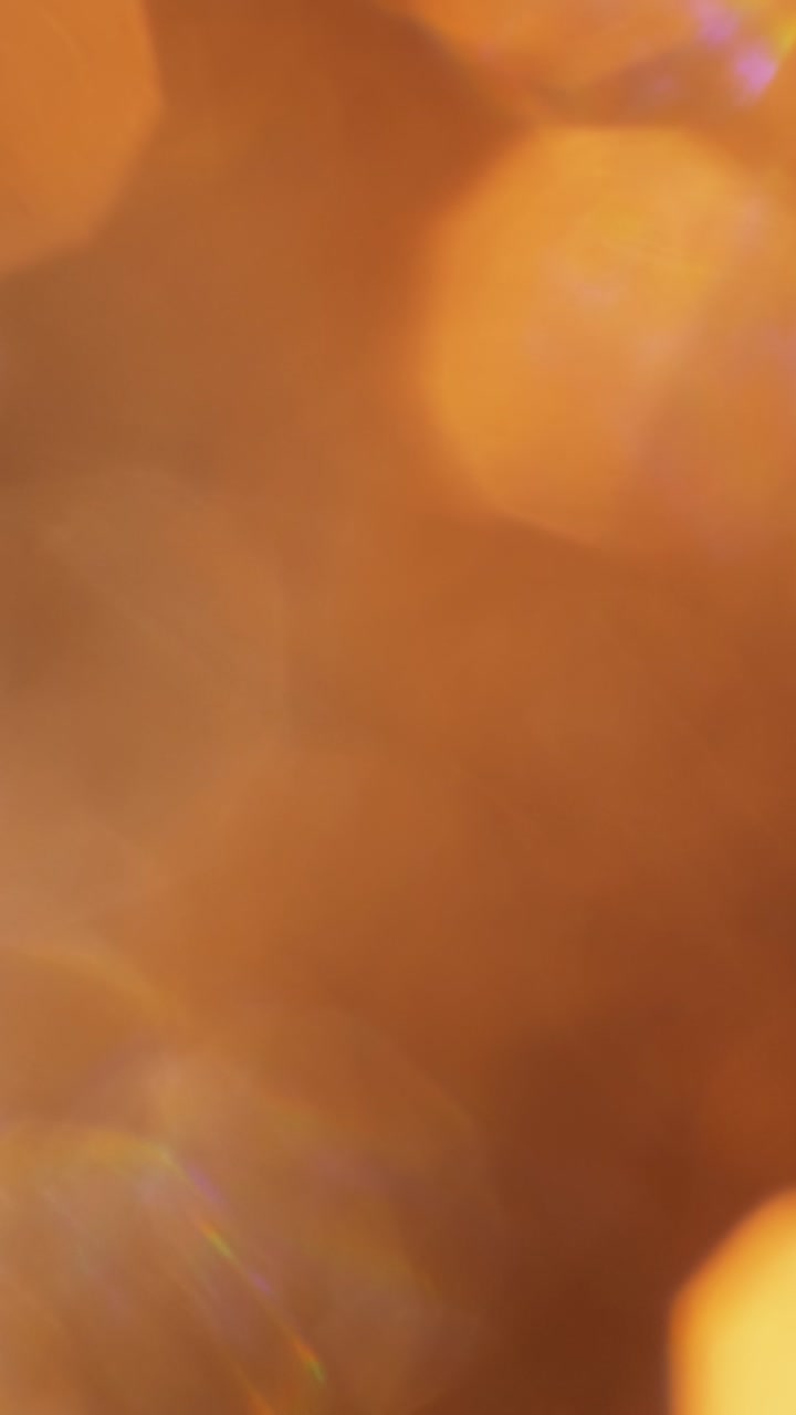 Sovrapposizione Astratta di Bagliori di Luce Bokeh Arancione Caldo