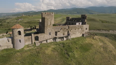 medieval samtsevrisi castle stronghold on grassy hilltop in georgia