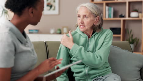 Elderly woman receiving medical consultation at home