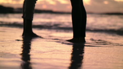 dipping their toes in the ocean