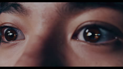 close-up of woman's eyes at night