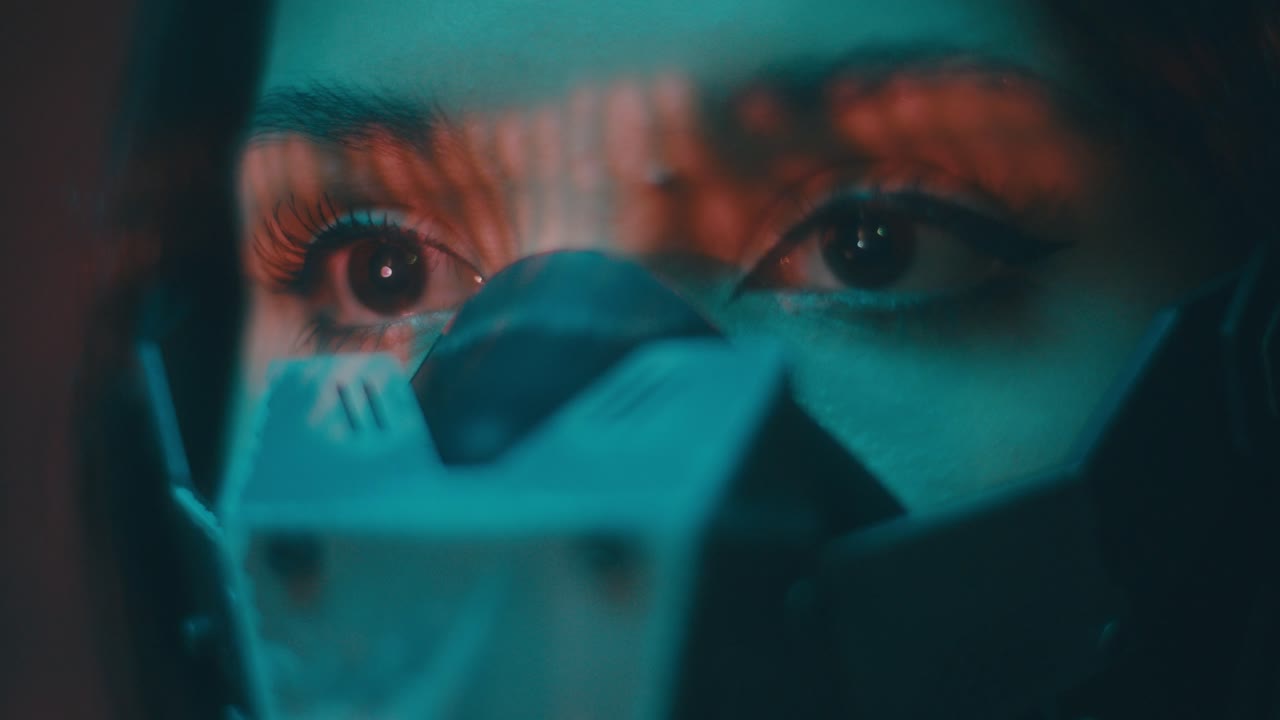 Woman wearing futuristic mask, close-up