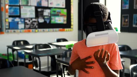 schoolboy using virtual reality headset in classroom 4k