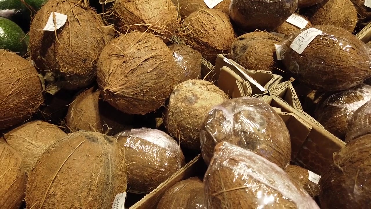 Coconuts in shop. Shooting with conducting.
