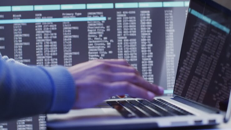 Video of biracial businessman using laptop over data processing