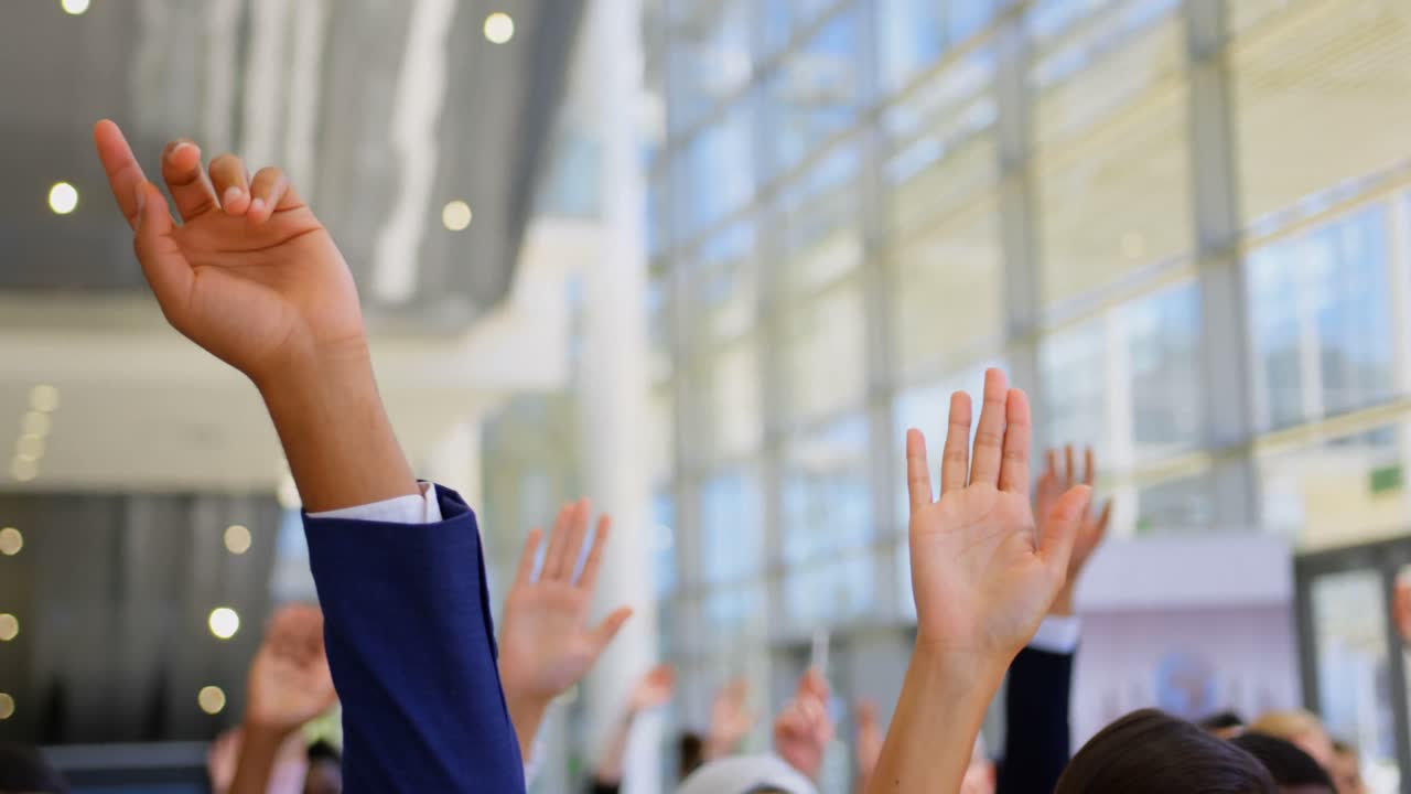 Multi ethnic business people raising hands in the business seminar 4k