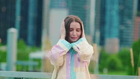 beautiful anxious girl covers ears with palms and shakes head as &quot;i dont want to hear this&quot; reaction