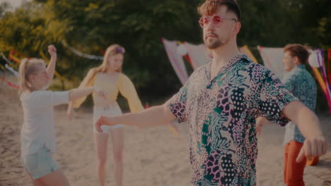 young carefree man wearing sunglasses dancing against friends