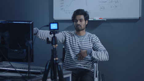 man in wheelchair giving a video presentation
