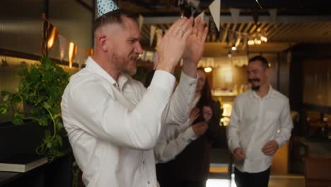 friends celebrating a birthday at a cafe