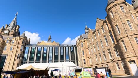 historic buildings and market stalls under clear skies