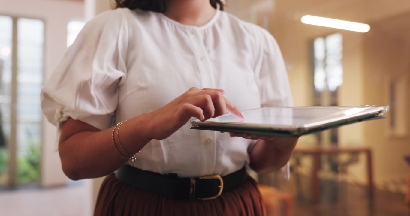 Woman Using Digital Tablet in Modern Office Setting