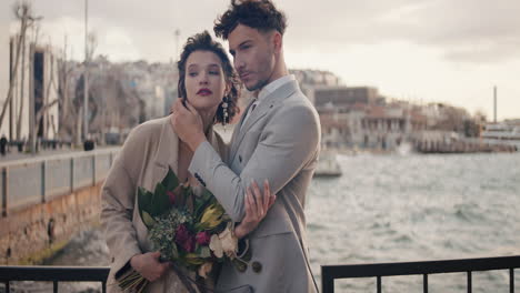 romantic couple portrait in a cityscape