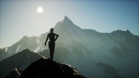 Woman-Standing-In-Snow-Wearing-Warm-Clothes-In-Mountains