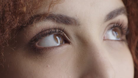 close-up-beautiful-young-woman-eyes-looking-up-pensive-contemplative-wearing-makeup