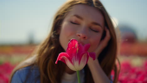 pretty girl enjoying flower. beautyful woman with closed eyes in floral garden.