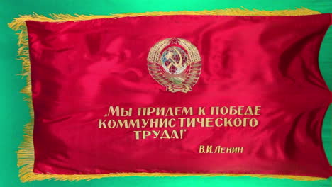 soviet parade flag with hammer and sickle flies in slow motion against green screen background