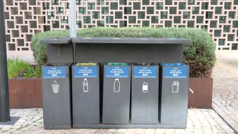 public recycling bins for organic, plastic, glass, metal, and paper waste