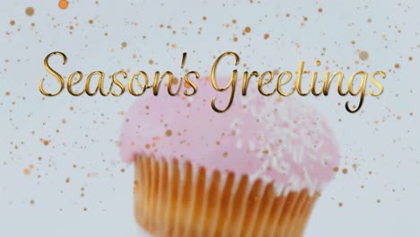 animation of christmas greetings over cupcakes on white background