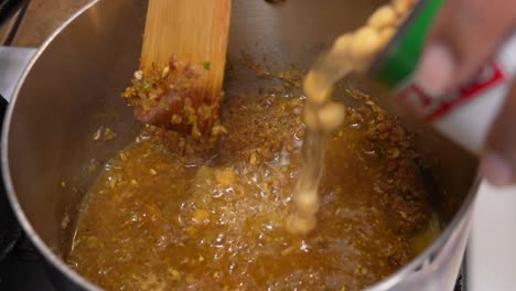 adding chickpeas to the onion sauce - chana masala series