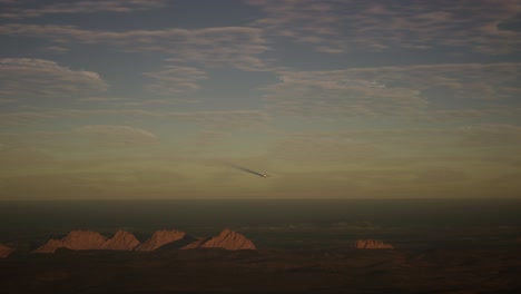 military airplane flying above the battlefield at sunset. war concept