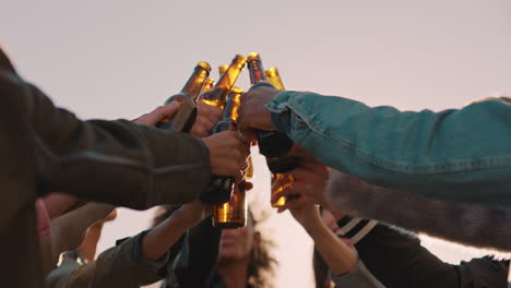 group-of-multi-ethnic-friends-celebrating-rooftop-party-making-toast-drinking-alcohol-enjoying-reunion-celebration-on-weekend-social-gathering-at-sunset