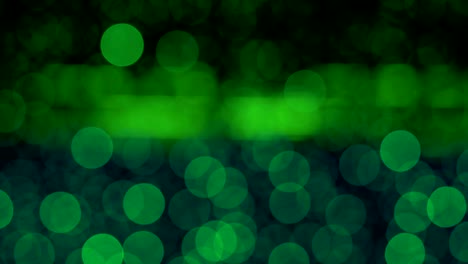 night abstract green background is defocused with nice bokeh. blurred christmas lights bokeh. pan across blur .