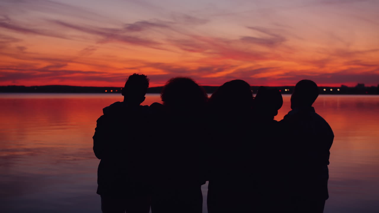 Friends Silhouette at Sunset Lake