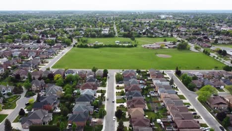 Flying-towards-a-large-park-in-a-Grimsby-neighborhood