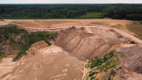 gravel extraction in local quarry, aerial drone view