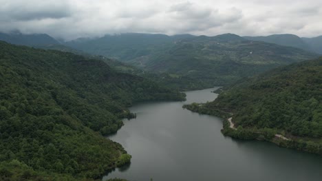 Beautiful-lake-in-north-Macedonia,-hills-and-mountains-with-forest-beside-the-lake,-the-natural-landscape-under-cloudy-sky