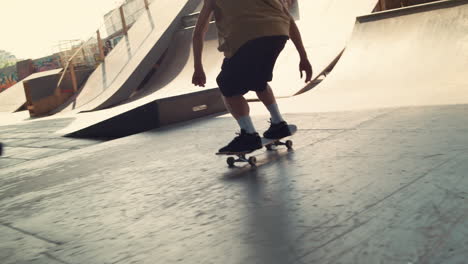 extreme skateboarder riding on skateboard outside. active boy jumping on rail.