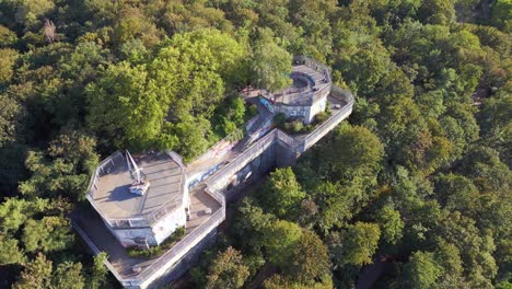 Majestic-aerial-top-view-flight-Flak-tower-Humboldthain-Bunker-World-War-2,-Berlin-mitte-summer-2023