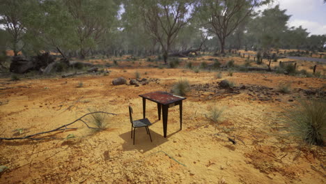 lonely table and chair in a desolate landscape during daytime