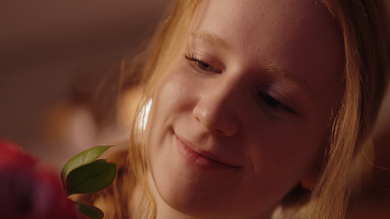 Woman smelling a bouquet of roses
