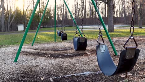 swings at park swinging in the wind