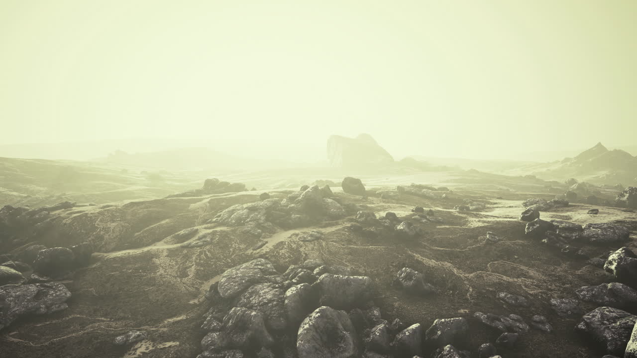 Vast rocky landscape shrouded in mist reveals natures wild beauty