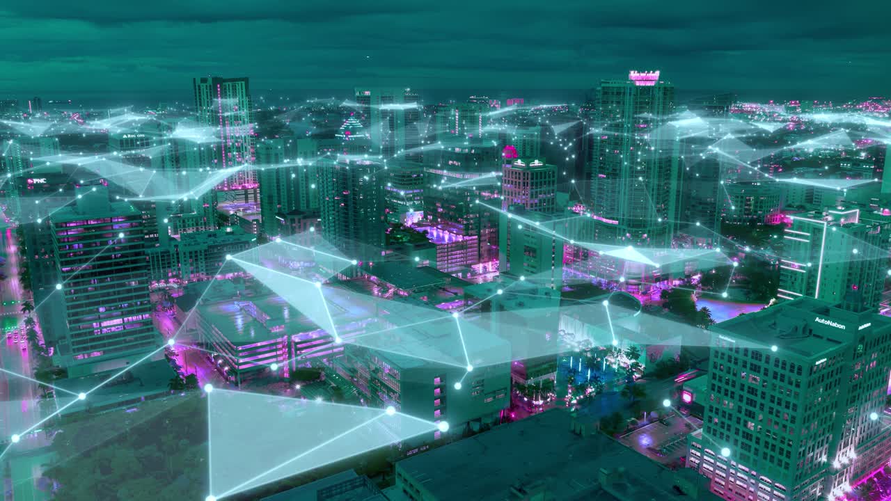 Night drone hyperlapse of a glowing U.S. smart city skyline with luminous data mesh connections visualizing broadband networks, AI communication, and future digital innovation