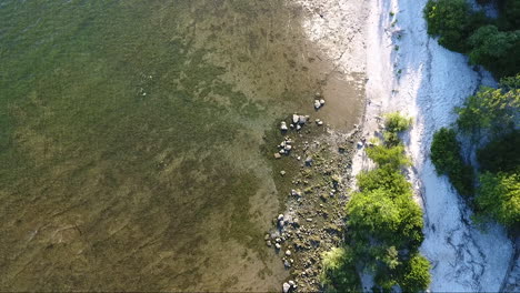 drone flying up over southern ontario lake