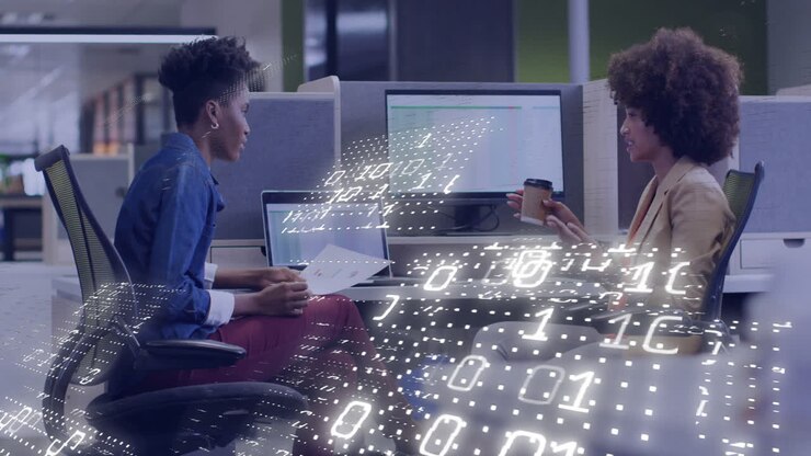 Two people discussing work at office with binary code animation overlay