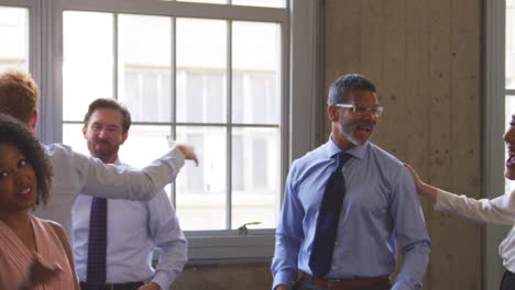 close up of business team celebrating success at a meeting