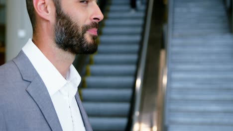 businessman having coffee from disposable cup