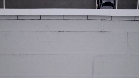 aerial view of a delivery driver in a white van in a parking lot