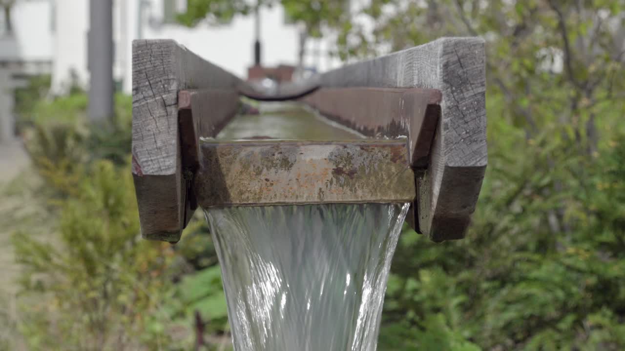 Part of a modern village water fountain in Kurtinig - Cortina, South Tyrol, Italy