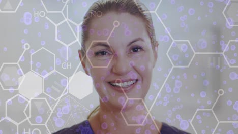 animation of scientific data processing over portrait of caucasian female doctor