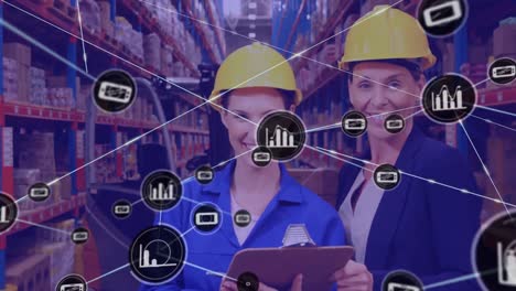 network of digital icons against portrait of female supervisor and worker smiling at warehouse