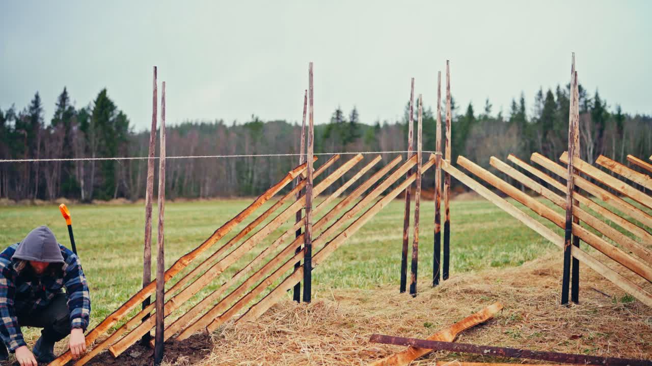 Man Constructing Skigard (Tradional Fence) In Norway - Timelapse