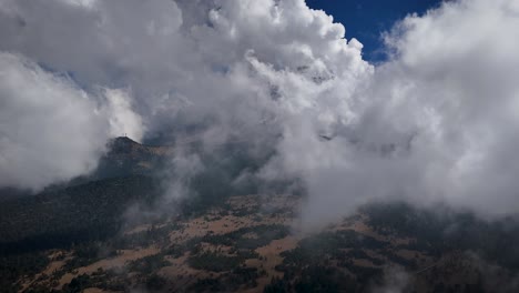 ascending drone shot revealing the popocatépetl volcano from paso de cortés, mexico